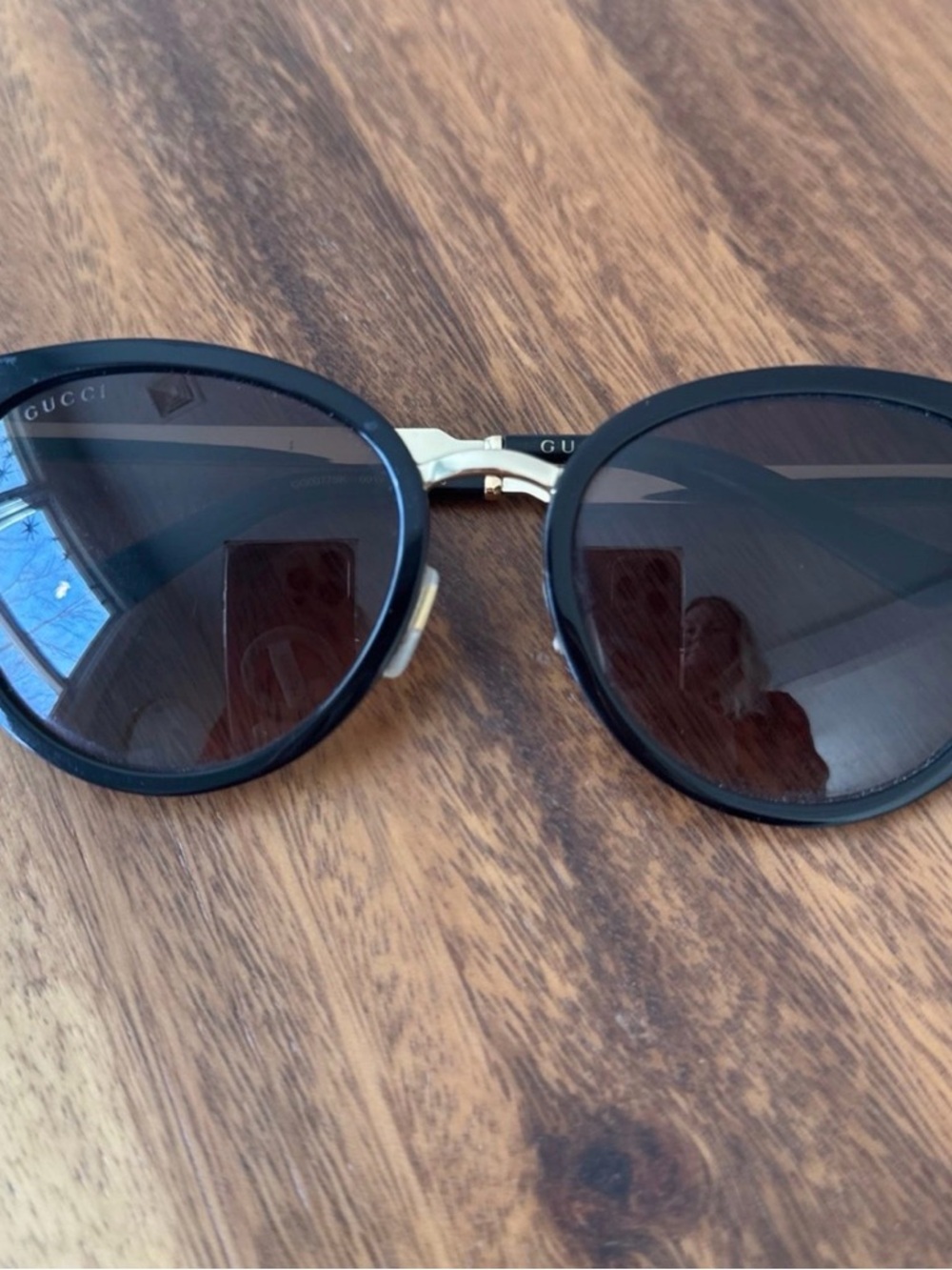 Gucci Black Frame Sunglasses with Gold Bridge